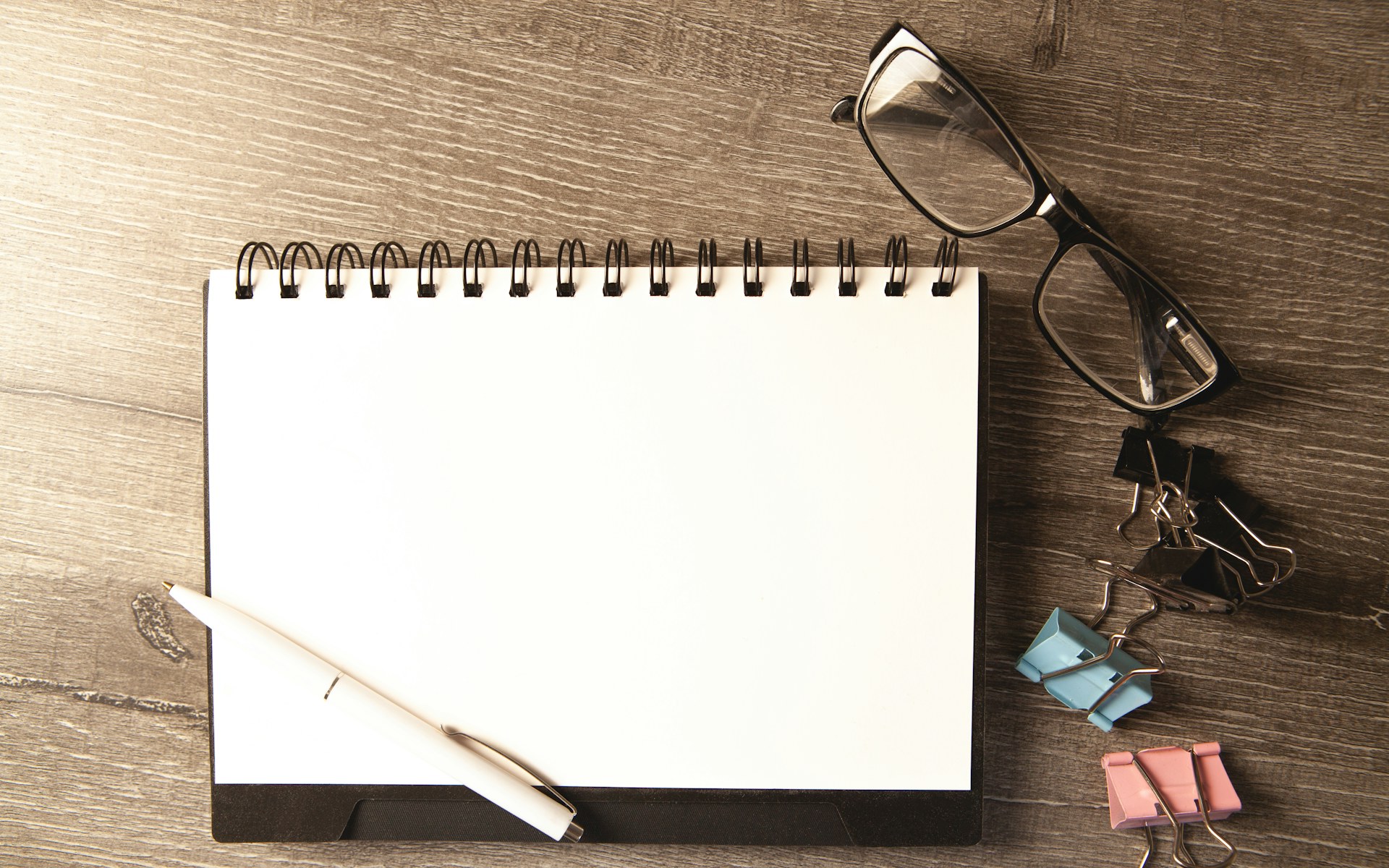 Stylised top-down illustration: smartphone next to a fanned-out contract on a navy desk